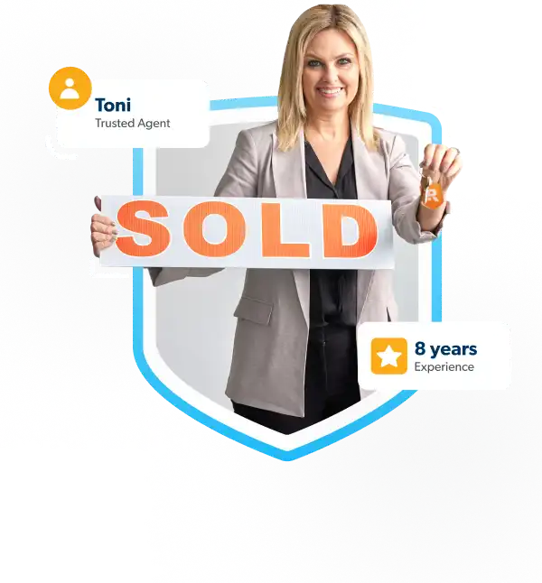 RamseyTrusted Agent Toni holding keys and a sold sign