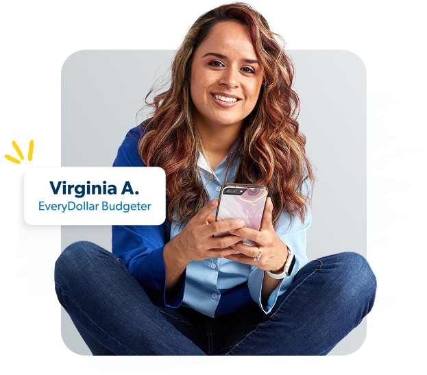 Woman holding a phone and budgeting with EveryDollar