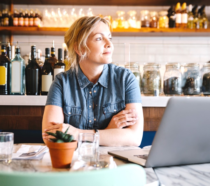 Woman sitting at cafe table