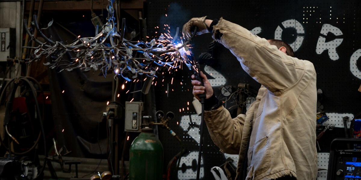 Urban Forge team member welding
