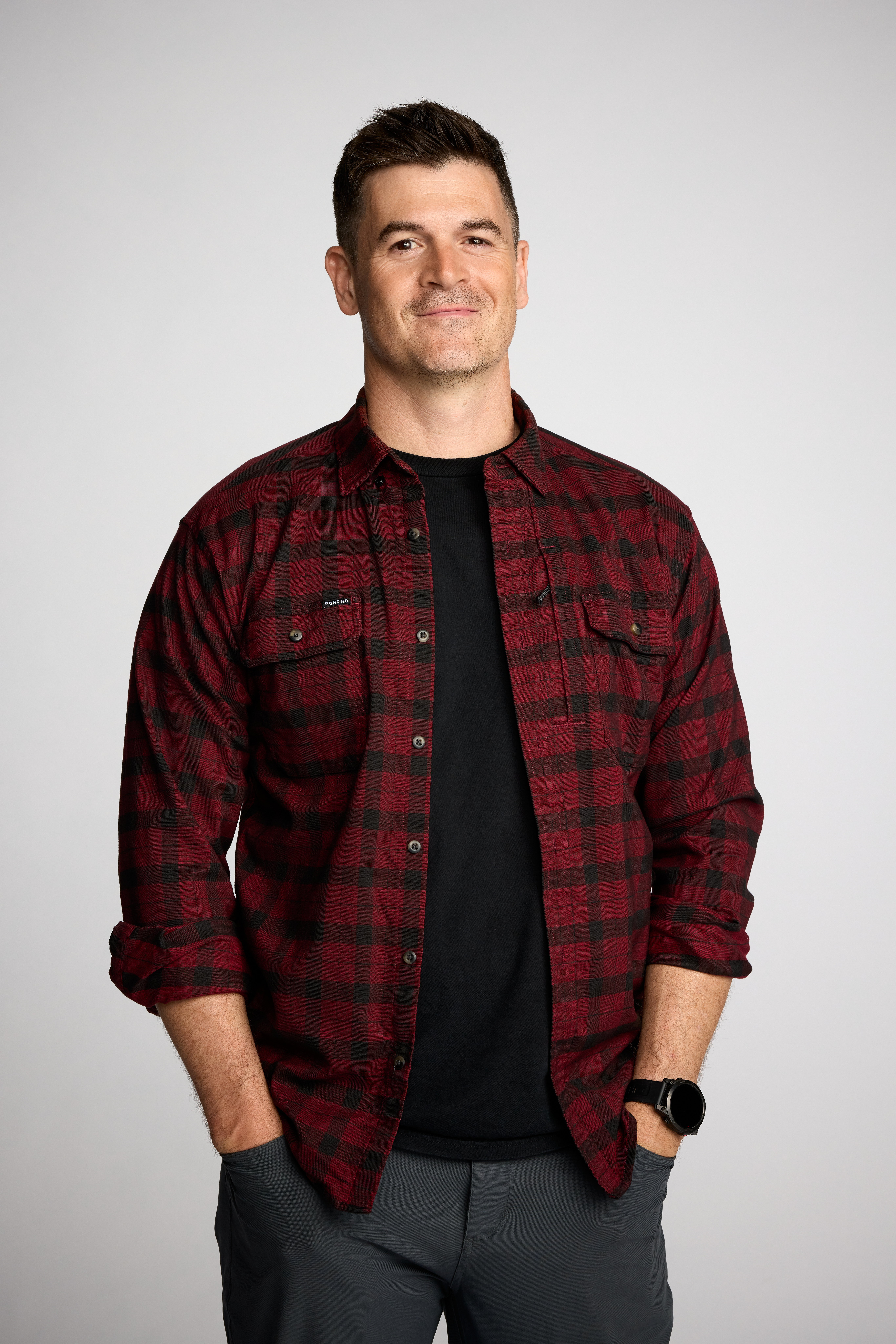photo of Dr. John Delony wearing a red plaid shirt