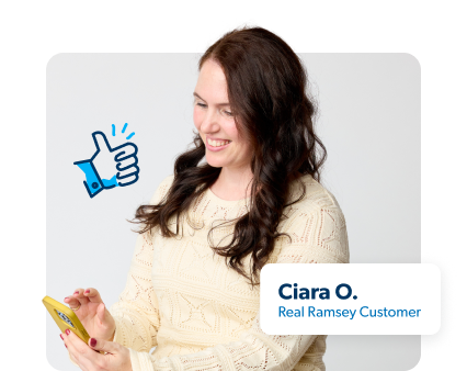 Woman holding a phone looking at term life rates.