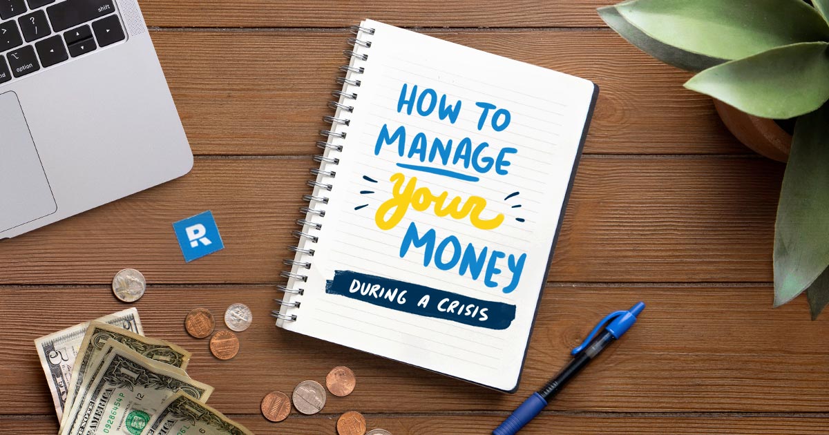 How to manage your money during a crisis written on a notebook surrounded by money and a laptop and pen