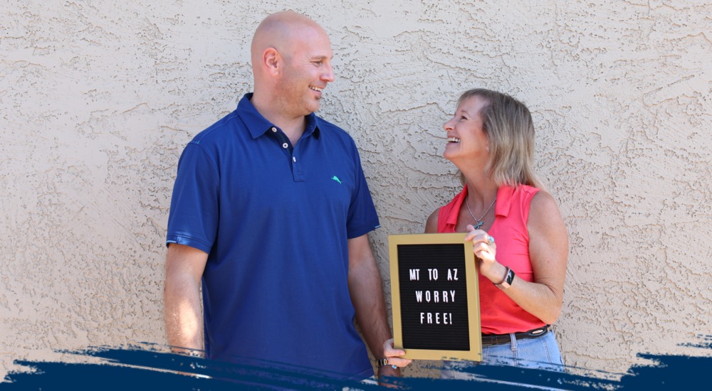 A couple is laughing together. 