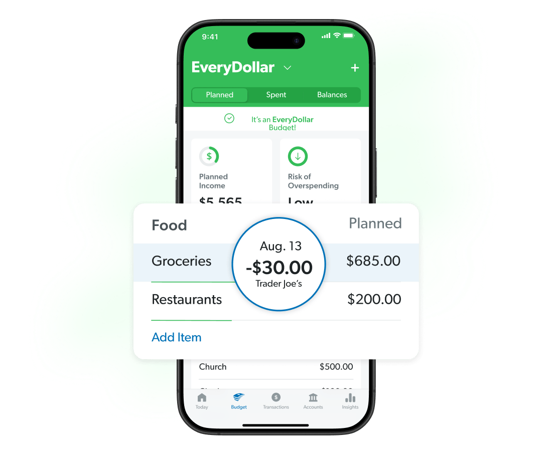 Couple with their son displaying they paid off their house and showing they are debt free