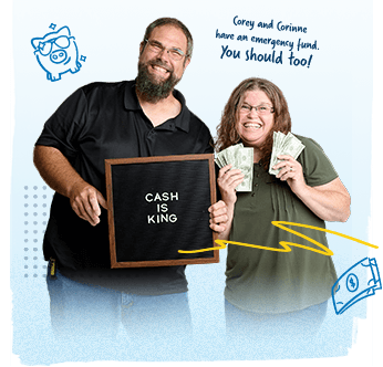 Photo of debt free couple holding a "Cash is King" sign. Corey and Corinne have an emergency fund. You should too!