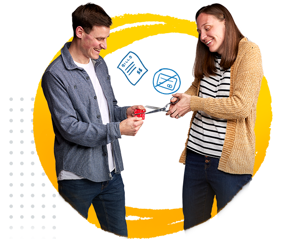 a couple cutting up their credit card