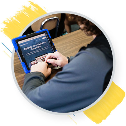 Student sitting at a desk using Foundations Curriculum on a tablet
